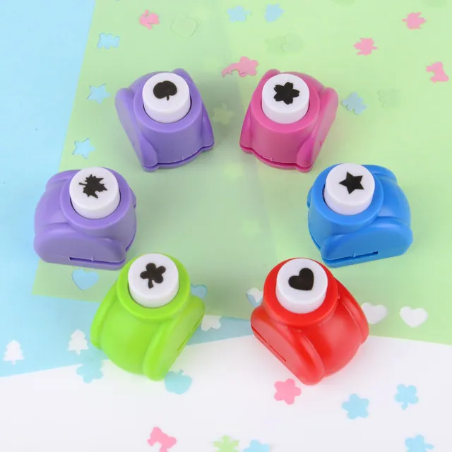 Shape punches on a pastel background with punched paper shapes