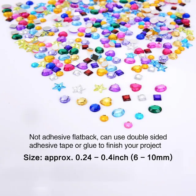 Adhesive gem stickers scattered on a white surface